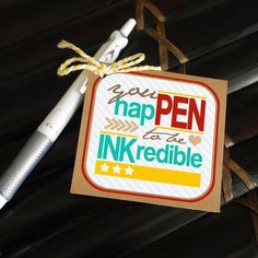 a pen is sitting next to a card that says, you have been inked