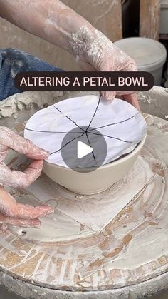 a person making a bowl out of clay with their hands on the bowl and text overlay reading, altering a petal bowl