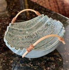 a blue bowl sitting on top of a counter