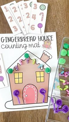 a gingerbread house counting mat and some candy