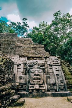 an ancient stone carving in the jungle