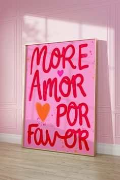 a pink sign that says more amor por faver on the side of a wall