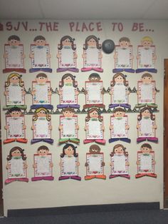 the bulletin board is decorated with pictures of children's faces and words on it