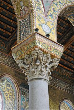 an ornate column in the middle of a building