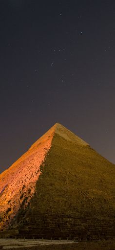 the large pyramid is lit up at night