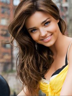 a beautiful young woman with long brown hair