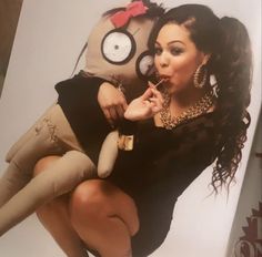 a woman in tights and heels is posing with a stuffed animal on her back