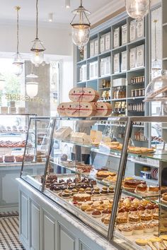 a bakery filled with lots of different types of pastries and desserts on display