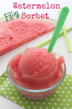 watermelon sorbet in a small glass bowl with a green straw next to it