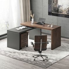 an office desk with a chair and laptop on it