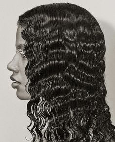 a black and white photo of a woman's head with curly hair on it