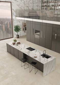 a modern kitchen with marble counter tops and stainless steel appliances in front of a large window