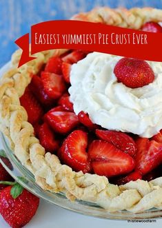 a close up of a pie with strawberries on top and the words, easy yummyest pie crust ever