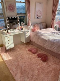 a bedroom with pink carpet and white furniture
