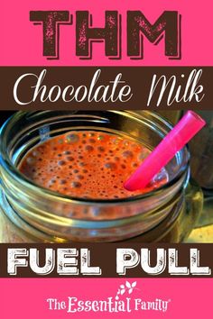 chocolate milk is in a jar with a pink straw sticking out of it and the words,