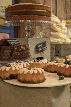 cakes and pastries on display in a bakery