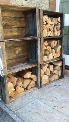 a stack of logs sitting on top of a wooden shelf next to a building door