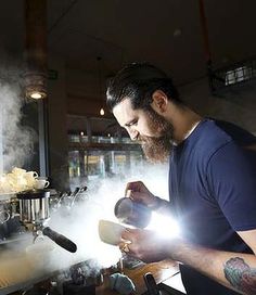 Barista Sean McManus makes coffe at Single Origin, Surry Hills, during the morning rush. Photo by Brianne Bar, Cool Cafe, Sydney Cafe