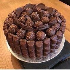 a chocolate cake sitting on top of a wooden table