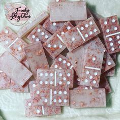 some pink and white candy squares on a table