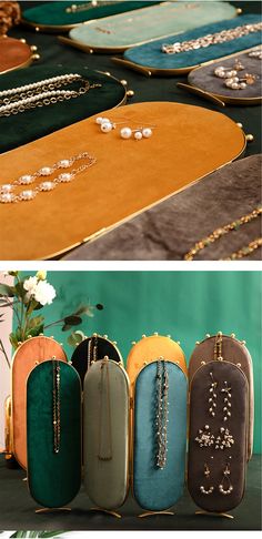 an assortment of purses and necklaces on display in front of a green background