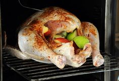 a whole chicken is being cooked in an oven