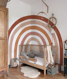 a child's room with a wooden bed and white rug