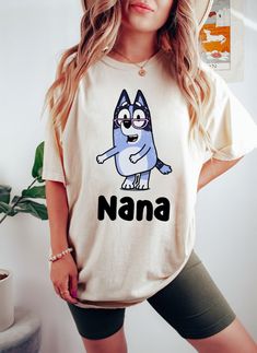 Bluey Nana Shirt, Bluey Chris Heeler Nana Shirt, Nana Shirt, Bluey Family Shirt, Bluey Trip Shirt, Funny Bluey Shirt PRODUCT DETAILS Gildan 5000 Medium fabric (5.3 oz/yd² (180 g/m Classic fit Runs true to size 100% cotton (fiber content may vary for different colors) Tear-away label Item Details: - Unisex fit perfect for both men and women - Tees are standard sizes so we suggest ordering your usual size for the perfect fit Technology & Inks: We use only top of the line equipment; we currently ru Tee Shirts, Family Shirts, Custom Printed Shirts, T Shirt, Travel Shirts, Shirt Shop, Bday, 2nd Birthday