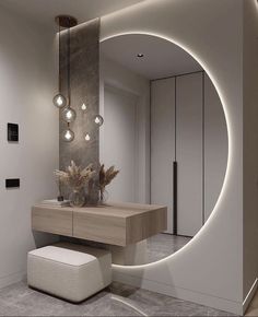 a modern bathroom with an oval mirror above the sink and stool in front of it