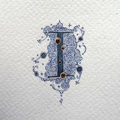 the letter i is made up of blue and white designs