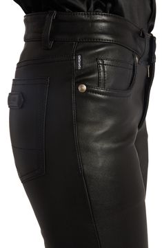 black leather pants with zippers and buttons on the side, showing the back pocket