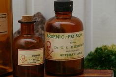 two medicine bottles sitting next to each other