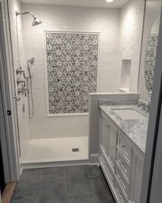 a bathroom with two sinks and a bathtub next to a walk - in shower