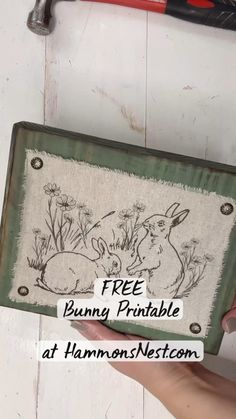 a person holding up a sign that says free bunnies printable at harmony nest
