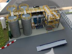 a model of a factory with pipes and tanks