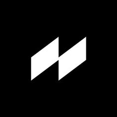 the letter n is made up of two diagonal white lines on a black background,