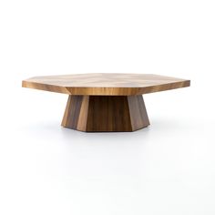 a wooden table sitting on top of a white floor