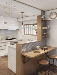 a kitchen with an island counter and wooden stools