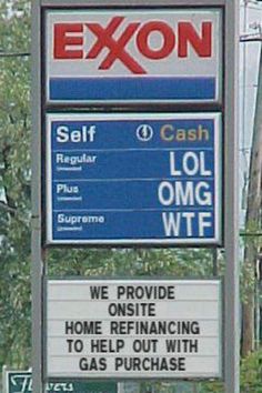 a gas station sign with the words exon on it's front and back