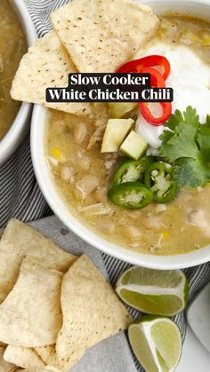 two bowls filled with white chicken chili and tortilla chips