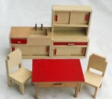 a doll house furniture set including a table, chair and sink with red countertop
