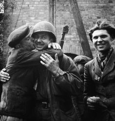 April 1945: A Polish man embraces an Allied soldier, kissing his cheek, after being liberated from a Nazi forced labor camp in Germany during World War II. (Photo by Tony Vaccaro/Hulton Archive/Getty Images) Soldier, Historical Images