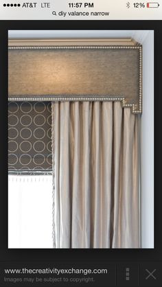 an image of a window with curtains and valances on the bottom, in front of a