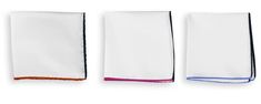 three white towels with blue, pink and orange trims on each towel side by side