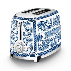a blue and white toaster sitting on top of a table