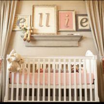 a baby's room decorated in pink and white