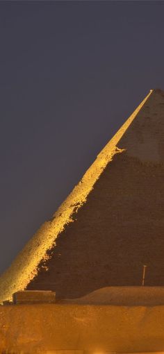 the giza pyramid is lit up at night