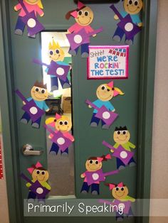 a door decorated with paper cutouts and stickers