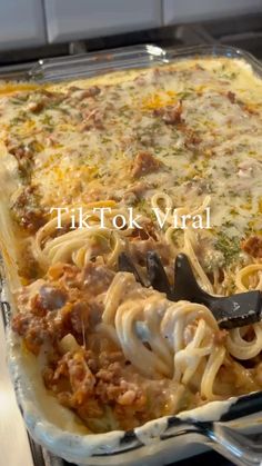 a casserole dish with noodles, meat and cheese