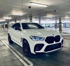 a white car parked in a parking garage